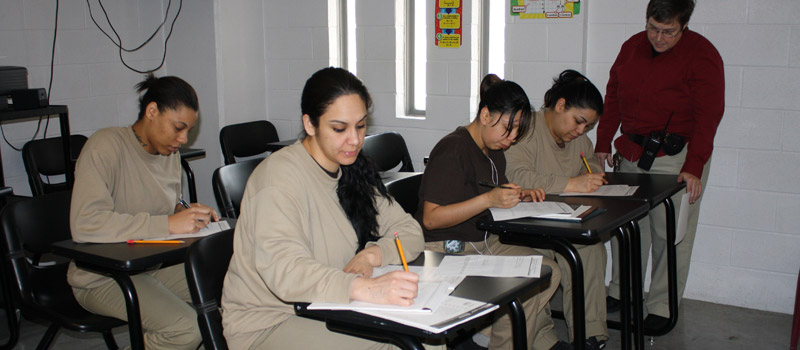 Photo of five people including four federal female offenders