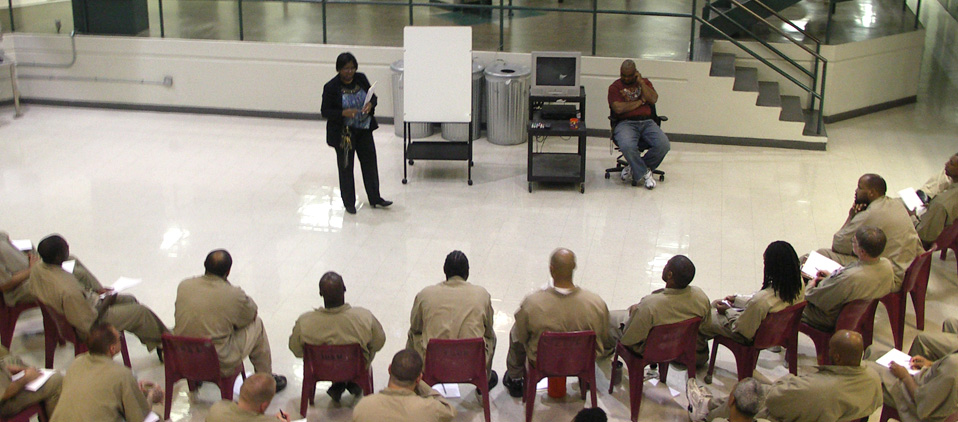 Federal inmates are receiving instruction from BOP staff while attending a BOP program